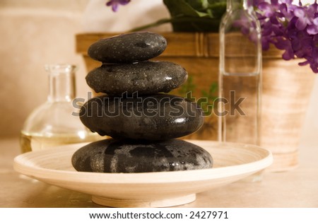 stones, oils, basket and flowers at a spa