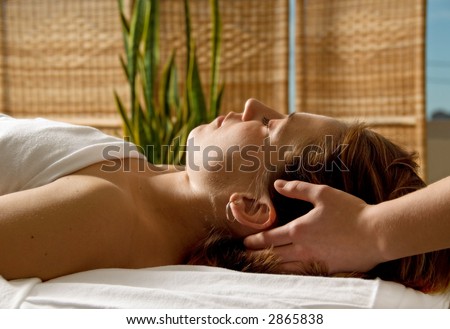 woman in a day spa getting a head massage