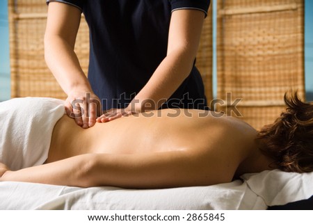 woman in a day spa getting a good massage