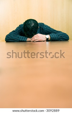 business man sleeping at his desk in the office