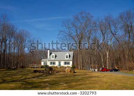 county house in the nature with lots of woods
