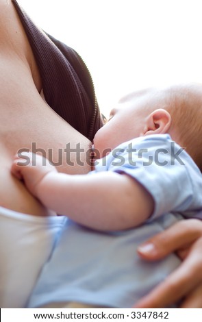 mom breast feeding her hungry baby boy