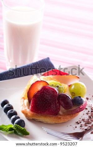 Fruit Tart on a white plate on a table