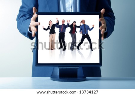 businessman holding an lcd monitor