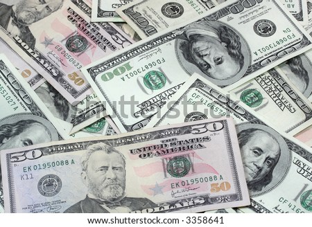 U.S. currency.  New 50 dollar and older style 100 dollar U.S. bills.
