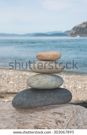 Stacking stones on the wood, different colors stones