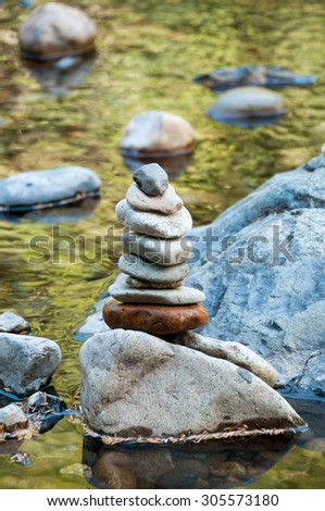 Stacking stones on the river coast, different colors stones