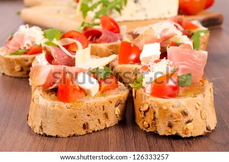 Small sandwiches on the wooden table