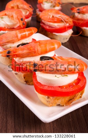 Selective focus on the front shrimp sandwich