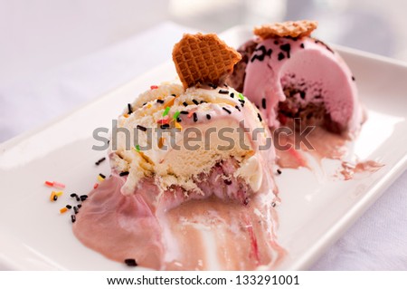 Melted ice cream on white plate