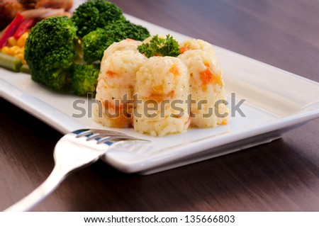 Prepared white rice with vegetables. Selective focus on the rice cup