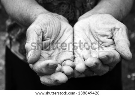 Old female hands in black and white