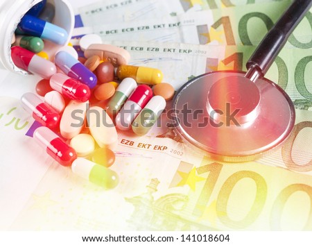 Splashed one hundred euro bills and pills