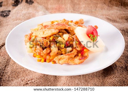 Pineapple and fried chicken meat with vegetables