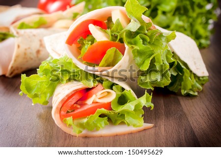 Fresh wrap snadwich with turkey meat and fresh vegetables