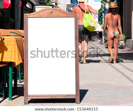 Blank menu board on the street. Selective focus on the blank board