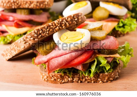 Dark toast sandwich with pork sausage and eggs