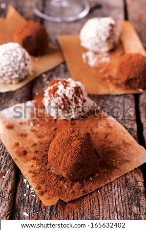 Chocolate truffles with chopped nuts.Selective on the front truffle