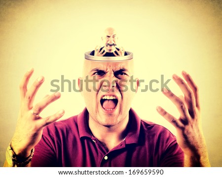Angry bald man with open head with himself in it