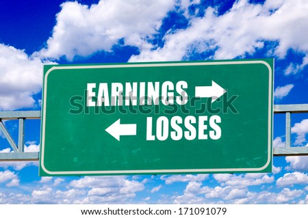 Earnings and losses sign on the green board with clouds in background