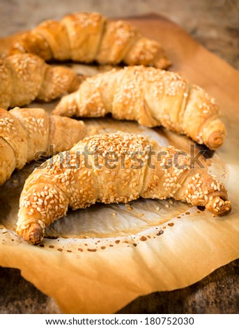 Selective focus in the middle of front Danish croissant with sesame