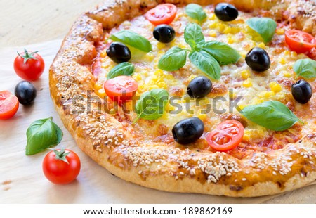 Vegetarian pizza with cheese and vegetables.Selective focus on the front part of pizza