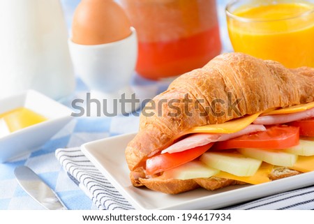 Fresh baked French croissant sandwich.Selective focus on the front part of sandwich