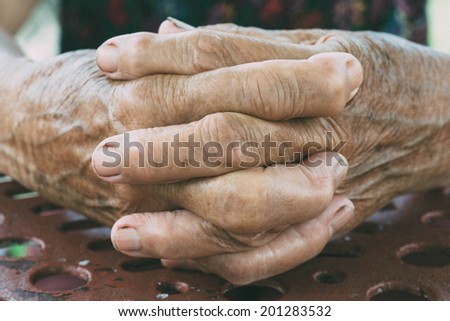 Selective focus in the middle of female old hands