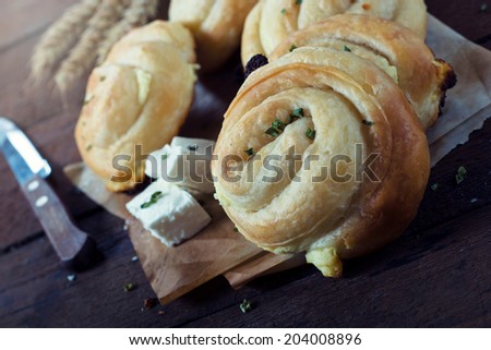 Tasty mini cheese pies on the wooden table.Selective focus on the front pie