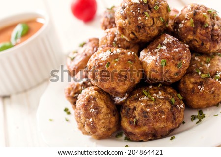 Juicy meatballs in the plate.Selective focus on the front meatballs