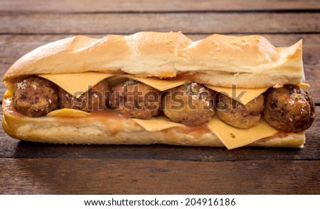 Meatball sandwich on the wooden table