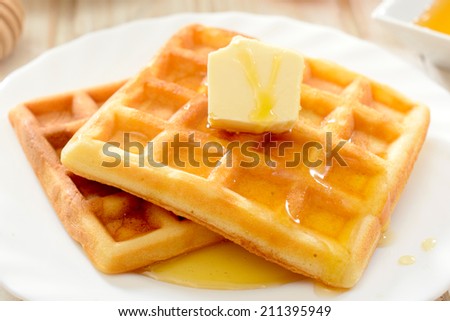 Traditional Belgian waffles with honey and butter