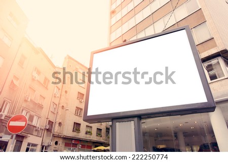 Blank city billboard with buildings in background,selective focus