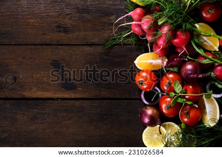 Large group of vegetables and fruit on the wooden background with blank space