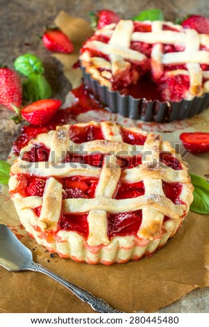 Homemade and baked tart cake stuffed with strawberries sauce,selective focus