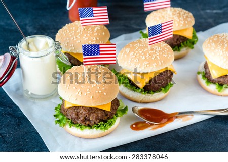 American mini beef burgers with cheese and USA flags,selective focus
