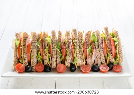 Large group of club sandwiches in the plate,selective focus