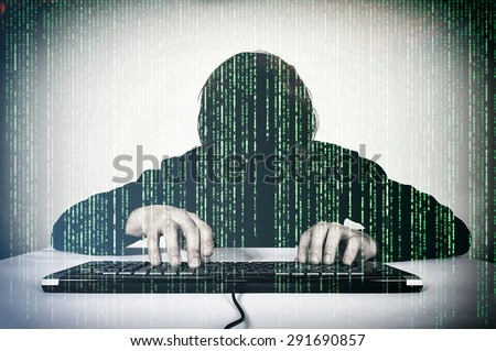 Hacker typing on the keyboard and mocking