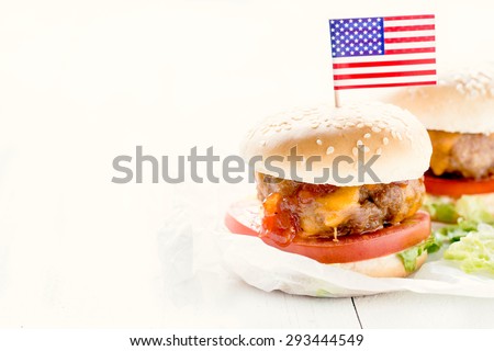 Mini beef burgers with melted cheddar cheese and bbq sauce,selective focus and blank space