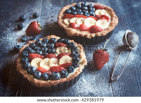 4th of July concept sweet mini pie with American flag white fruit on wooden background,selective focus
