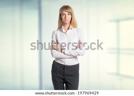 Portrait of young business woman white shirt black trousers pants in office isolated