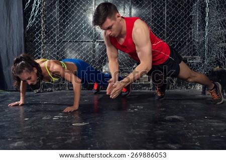 Sportsmen. fit male trainer man and woman doing clapping push-ups explosive strength training concept  fitness workout strength power.