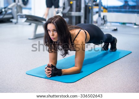 training fitness woman doing plank core exercise working out for back spine and posture Concept pilates sport