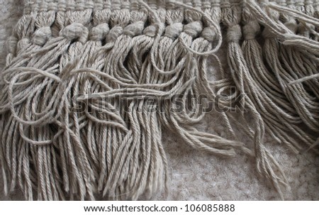 close up of the fringe of a rug, horizontally oriented / Living on the Fringe