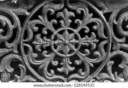horizontal orientation close up of vintage wrought iron with circular pattern and scroll work / Vintage Tennessee