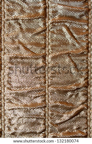 vertical orientation close up of neutral brown colored ruched fabric with lots of copy space / Neutral Ruche