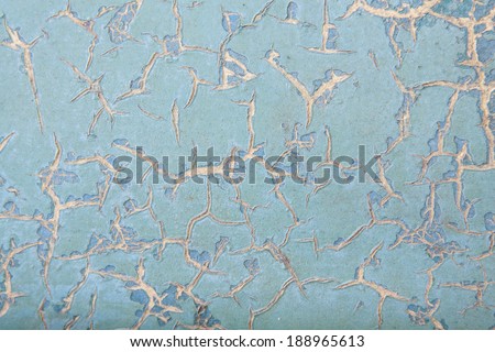 horizontal orientation close up of a vintage metal surface in porcelain blue color, with deep cracks throughout and copy space / Porcelain Blue Distressed Surface