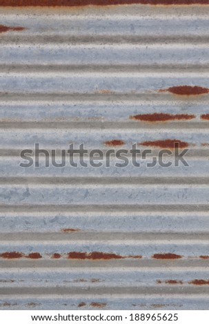vertical orientation close up of a worn, metal panel with rust spots and copy space / Rusty Background - Vertical