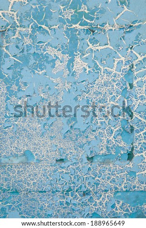 vertical orientation close up of a vintage metal surface, with layers of cracking paint, in a porcelain blue color, with copy space / Vintage Distressed Metal Surface - Vertical
