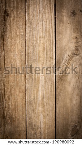 vertical orientation close up of weathered wooden boards in a warm finish, as a background or texture with copy space / Vertical Wooden Boards